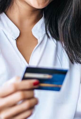 woman holding a credit card
