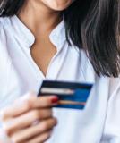 woman holding a credit card