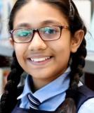 girl with glasses smiling