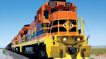 orange and yellow train daytime