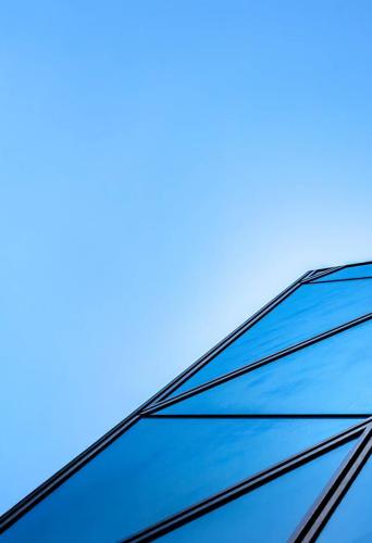 Upview of building against blue sky