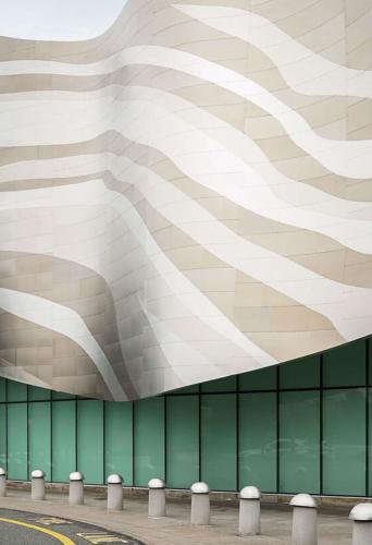 Modern building with wavy exterior patterns