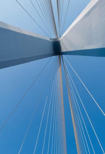 Looking up at a suspension bridge